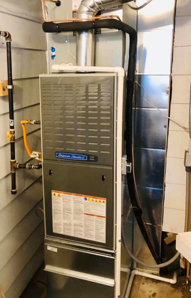 A new HVAC furnace and air handler unit with updated piping installed by Family Heating & Air Conditioning in Indianapolis, IN.