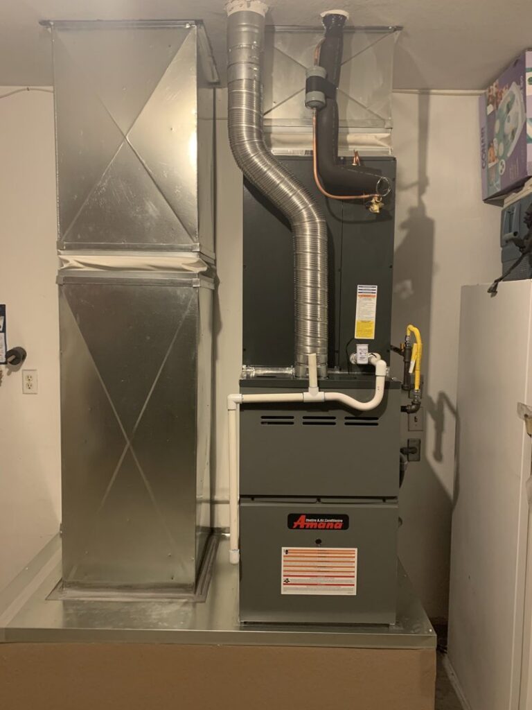 A newly installed indoor HVAC furnace and air handler unit with ductwork by Sahara Air Conditioning & Heating in Las Vegas, NV