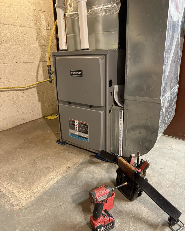 A new Concord HVAC furnace unit installed by Tru-Sky Heating & Cooling in Pittsburgh, PA, with tools nearby.