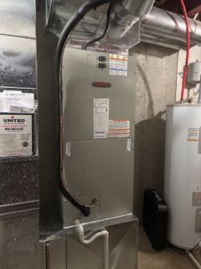 A modern HVAC furnace system installed in a residential basement by Pro-Cool Air Conditioning & Heating in Blue Springs, MO.