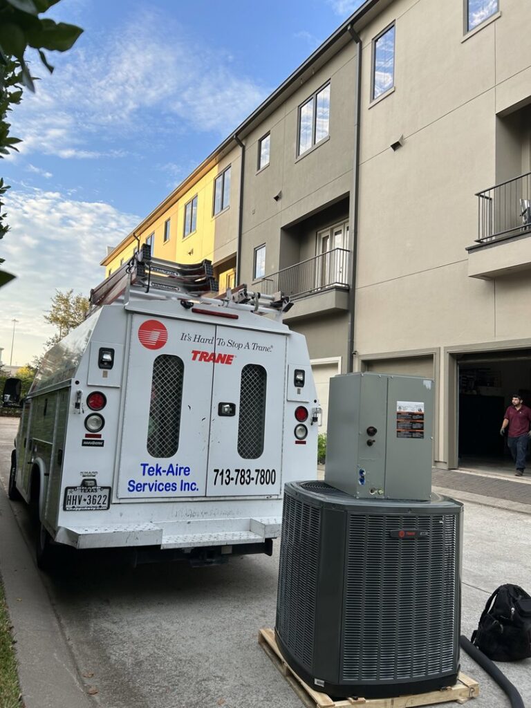 A new outdoor HVAC condenser and indoor air handler unit ready for installation by Tek-Aire Services Inc. in Columbia, SC.