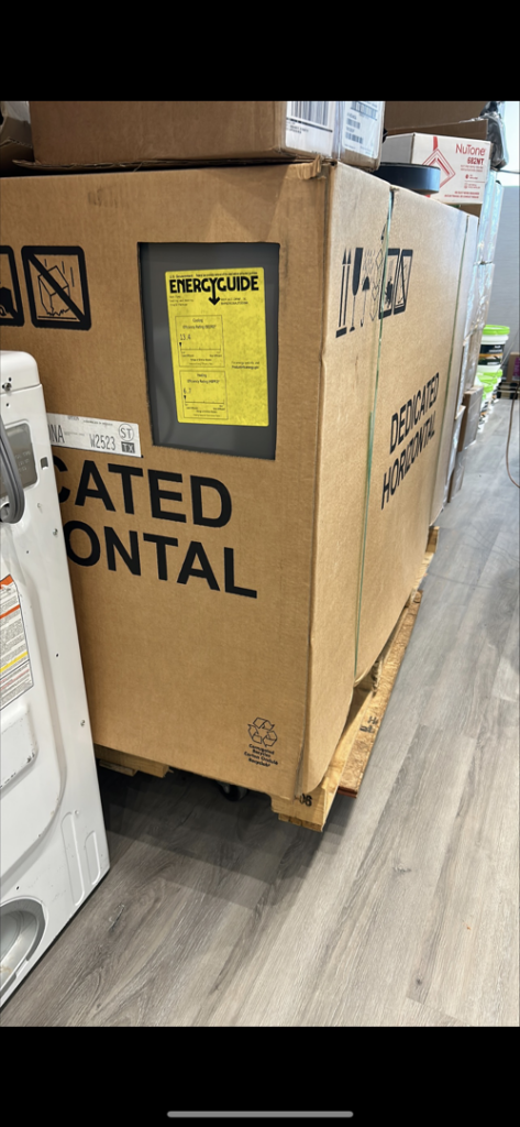 A new horizontal HVAC unit in its packaging with an energy guide label, ready for installation by HP Mechanical LLC in Santa Rosa, CA.