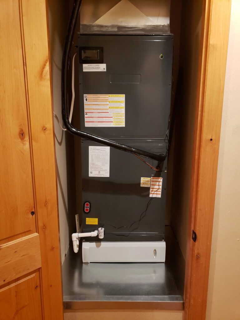 A new indoor HVAC air handler installed in a utility closet by Arrow Pro Services in Gilbert, AZ