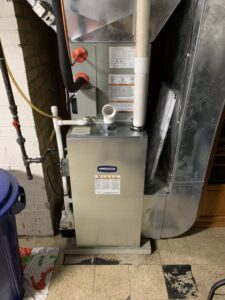 A newly installed indoor HVAC furnace unit with ductwork by Berkshire Heating and Cooling in Pittsburgh, PA