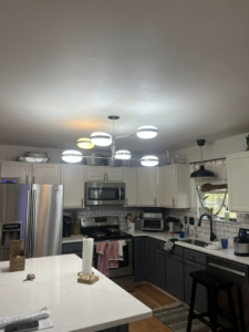 A modern kitchen featuring a newly installed multi-light ceiling fixture by PnP Electric in Middletown, DE.