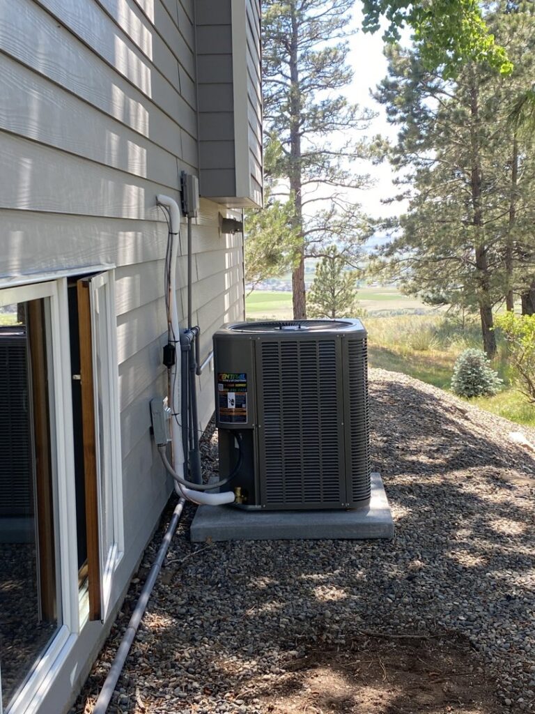 A newly installed Lennox AC unit next to a residential home by Central Heating & Air Conditioning in Billings, MT