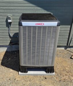 A newly installed Lennox outdoor air conditioning unit by Theisen Heating, Air Conditioning & Furnace Cleaning in Yakima, WA.