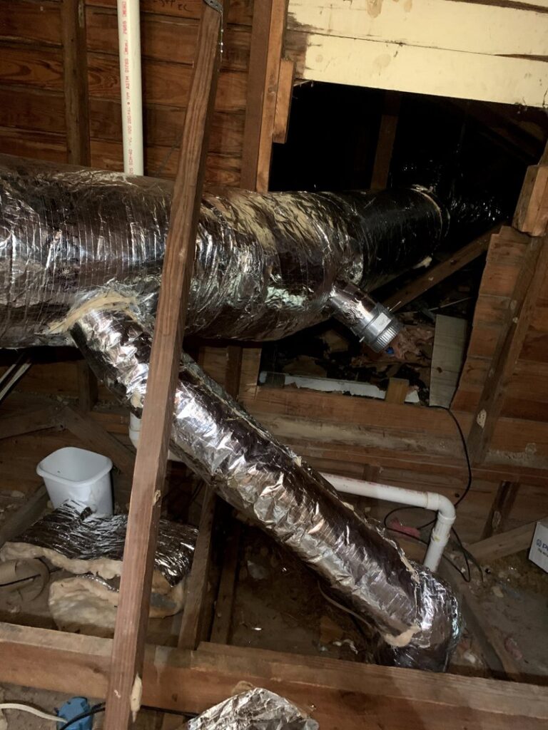 A new Lennox furnace and air handler installation with ductwork in an attic by Comfortech-Service Experts Jackson in Jackson, MS