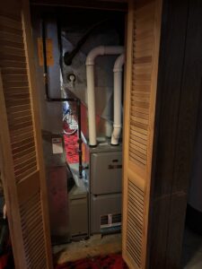 A new Lennox furnace installation in a utility closet by Nordic Air Heating & Cooling in West Allis, WI.