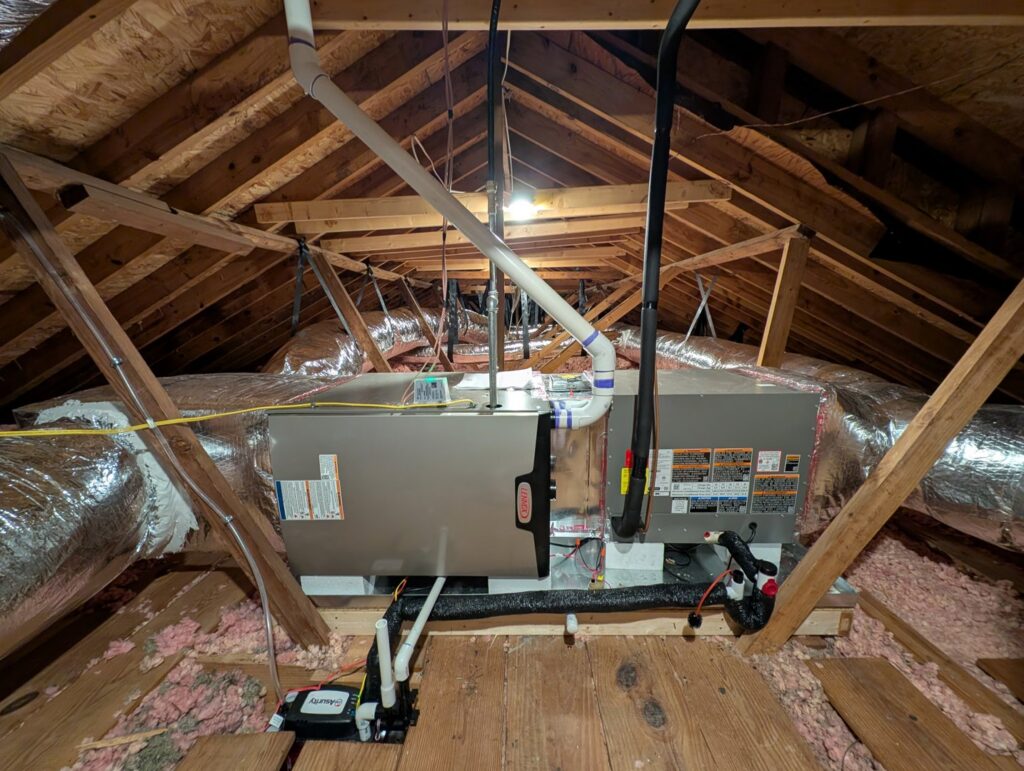 New Lennox HVAC furnace and air handler unit with ductwork installed in an attic by Stoudenmire Heating & Air Conditioning, Columbia, SC.