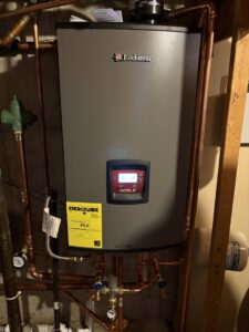 A newly installed Lochinvar Noble boiler with copper piping by All In One Home Services in Denver, CO.