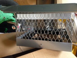 A new metal chimney cap, a product installed by Chimney Usa Inc in Chicago, IL.