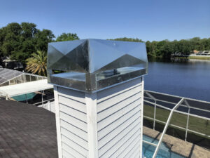 A newly installed metal chimney cap on a residential chimney by A Sweep Across the Bay in Parrish, FL.