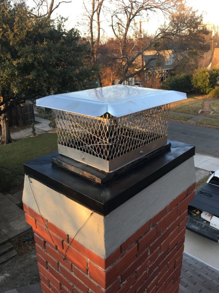 A newly installed metal chimney cap on a brick chimney, demonstrating chimney services by HBR Hearth and Chimney in Dallas, TX