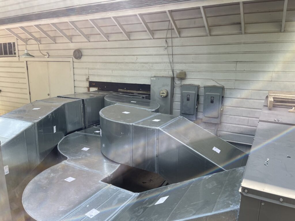New sections of metal HVAC ductwork laid out for installation by Emergency Air in Chandler, AZ.