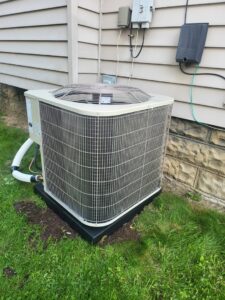 A newly installed outdoor AC condenser unit next to a residential home by 511Comfort, LLC in Nashville, TN.