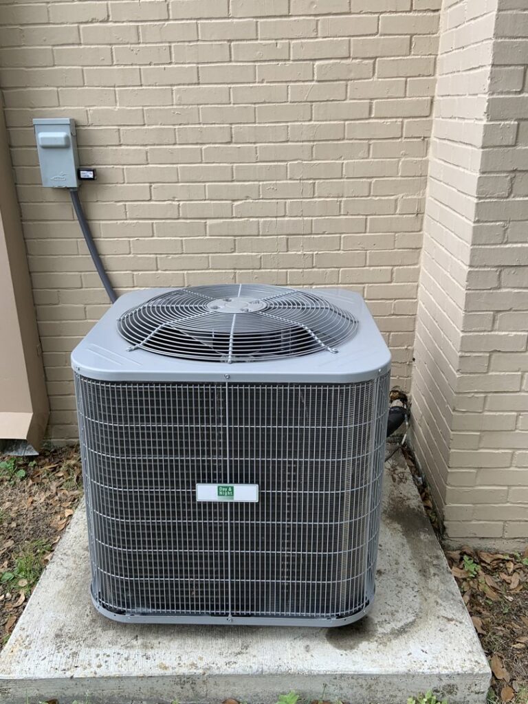 A newly installed outdoor AC condenser unit next to a brick wall by Calloway & Sons A/C And Heating in New Orleans, LA.