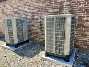 Two newly installed outdoor AC condenser units for a home by Trinity Climate Control in Clayton, NC.