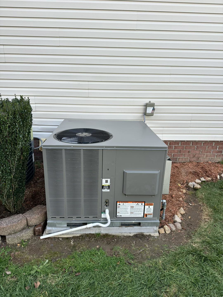 A newly installed outdoor air conditioning unit by EndorFin Service's Inc. Heating & Air Conditioning in Gloucester, VA.