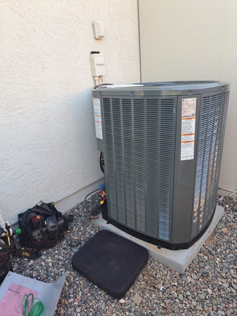 A newly installed outdoor AC unit with tools nearby by ASAP Air Conditioning and Heating in Mesa, AZ.