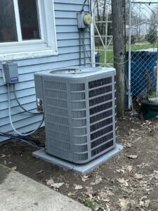A newly installed outdoor air conditioning unit next to a residential home by Great Lakes Heating & Air Conditioning in Wickliffe, OH.