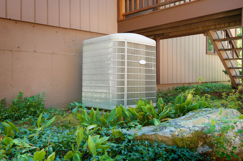 A newly installed outdoor AC unit next to a residential home by Malone Heat & Air, Inc. in Chattanooga, TN