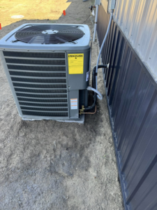 A newly installed outdoor air conditioning unit by Missouri River Heating & Cooling in Mandan, ND.