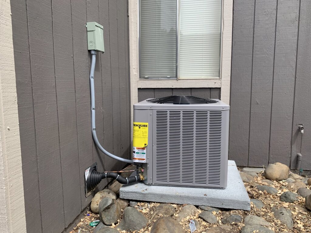 A newly installed outdoor air conditioning unit by Paul's Heating & Air Conditioning in Virginia Beach, VA.