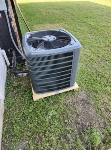 A newly installed outdoor air conditioning unit by R U Hot or Cold, P O Box 962.