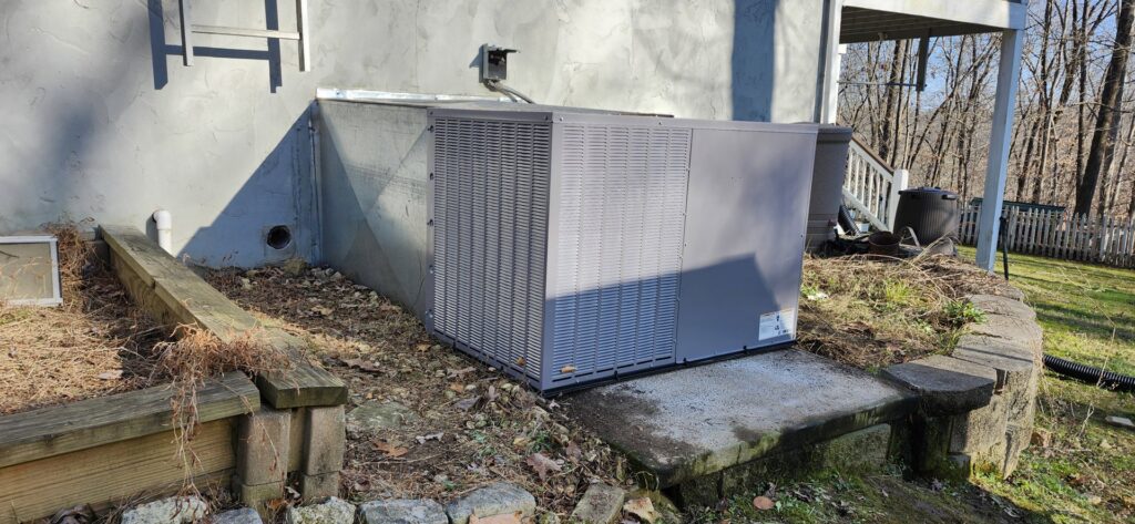 A new outdoor AC unit installed next to a house by Recovery HVAC in Smyrna, TN.