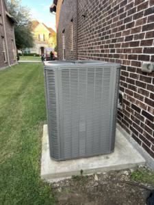 A newly installed outdoor AC unit next to a brick residential home by Sonnyreena Mechanical LLC in Garland, TX