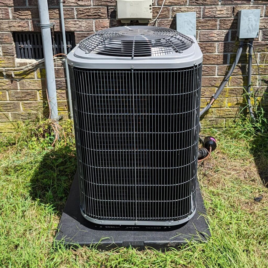 A newly installed outdoor air conditioning unit by Turner & Son's Heating and Air in Anderson, IN