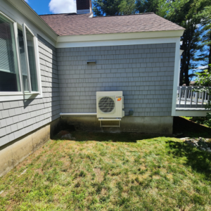 A newly installed outdoor heat pump unit on the exterior of a home by Element Heat Pumps in Gray, ME.