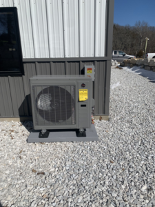 A newly installed outdoor HVAC unit by Symbiont Services, providing heating and cooling in Englewood, FL.