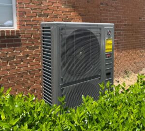 A newly installed outdoor HVAC unit by Tadlock Heating & Air Conditioning in Tallahassee, FL