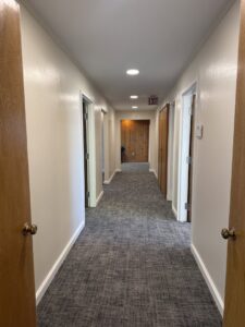 A hallway with new grey patterned carpet installed by Carpet Depot Okc in Oklahoma City, OK.