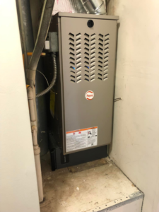 A new Payne brand furnace installed in a utility closet by Maverick Hvac in Morehead City, NC.