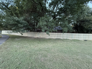 A newly installed picket fence by Master Fence Builders in Fort Smith, AR, enhancing a residential property.