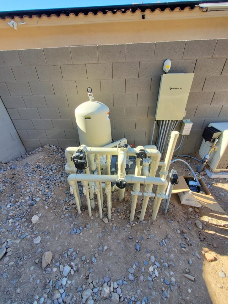 New pool equipment, including a large filter and complex plumbing, installed by EZ POOL Solutions in Tucson, AZ