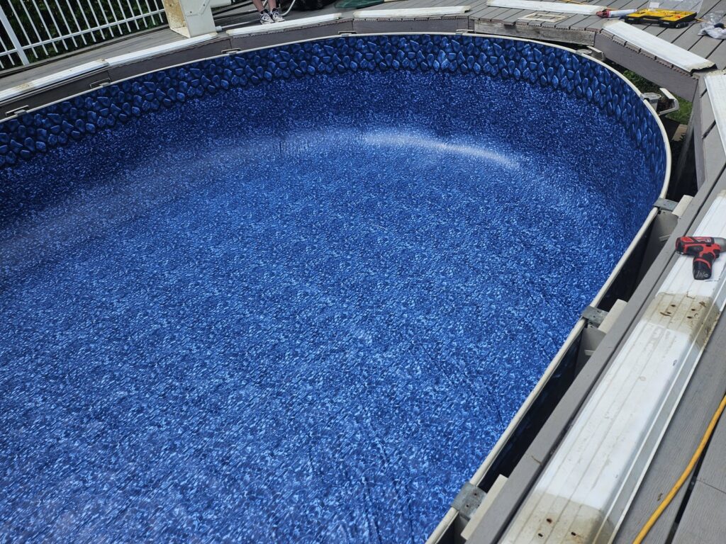 A newly installed pool liner being filled with water in a different pool, showcasing expert liner installation by Westside Pools in Owensboro, KY.
