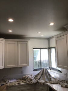 A modern kitchen featuring newly installed recessed lighting in the ceiling, completed by AAA Electrical Services in Sacramento, CA.