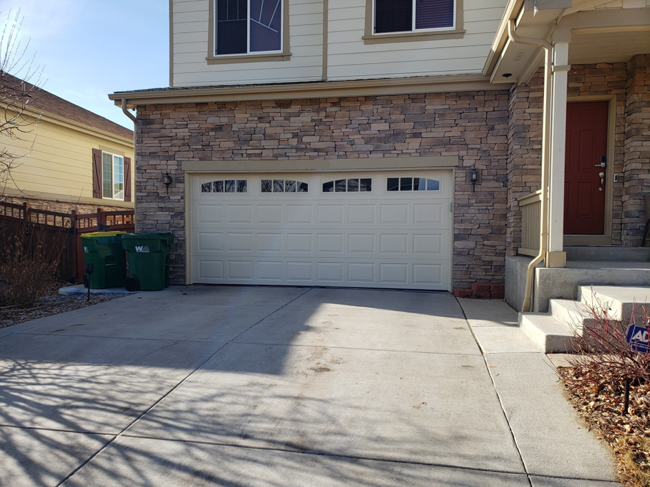 A newly installed residential garage door by 170 Springs LLC Garage Doors in Aurora, CO