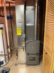 A newly installed Rheem furnace and air handler unit, representing an HVAC installation by ACW Heating & Air in North Aurora, IL
