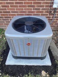 A new Rheem outdoor air conditioning unit installed by Air Fix in Fayetteville, AR.