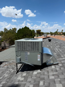 A newly installed rooftop HVAC unit with fresh ductwork by Otto's Air Conditioning & Heating in Mesa, AZ.