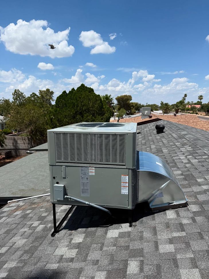 A newly installed rooftop HVAC unit with fresh ductwork by Otto's Air Conditioning & Heating in Mesa, AZ.
