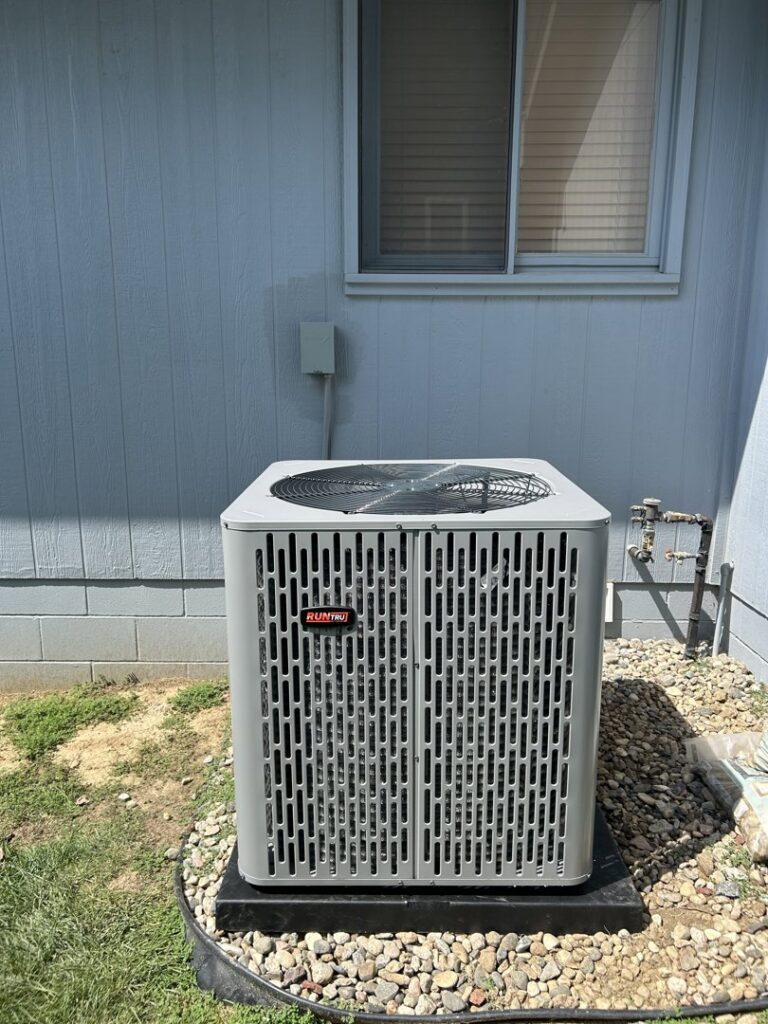 A newly installed RunTru outdoor air conditioning unit by Sandys Heating & Air in Papillion, NE.