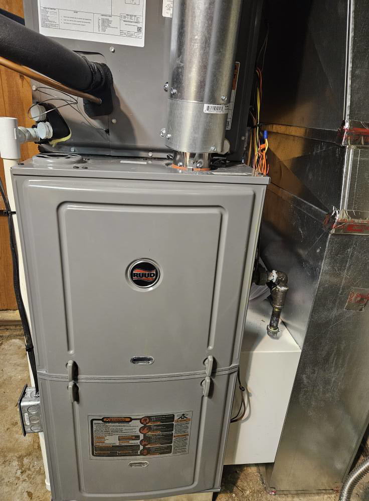 A newly installed Ruud furnace unit, ready for operation by Astron Services LLC in Wichita, KS.