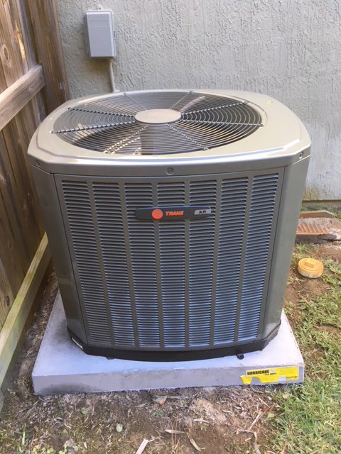 A newly installed Trane XR outdoor air conditioning unit by 911 Heating and Air Conditioning Co.,Inc. in Mary Esther, FL