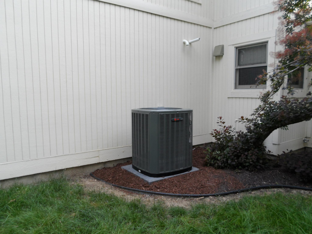 A newly installed Trane AC unit outside a home by Extreme Heating and Cooling II - Indiana, serving Westfield, IN.